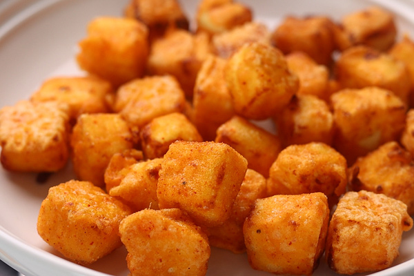 all paneer cubes are fried until crisp and golden
