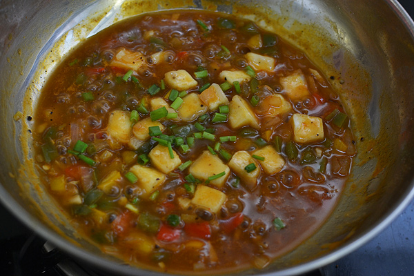 fried paneer is added along with spring onion