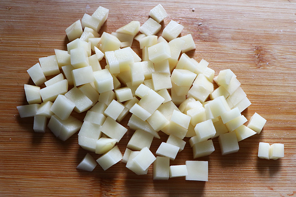 then horizontal cuts are made to get small potato cubes
