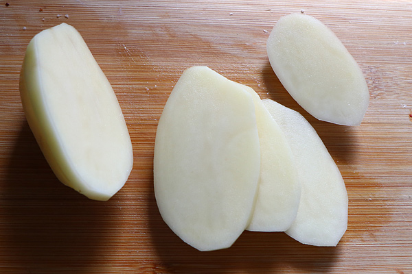 each potato cut into thick slices