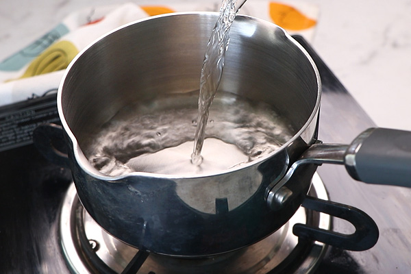 add water to a sauce pan