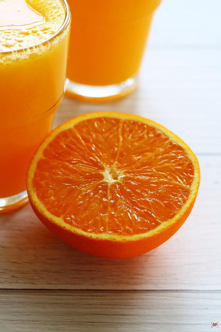 sliced orange with freshly squeezed orange juice