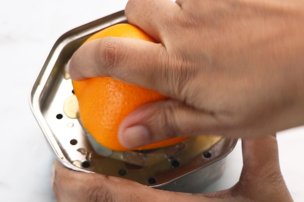 squeeze the orange to extract the juice