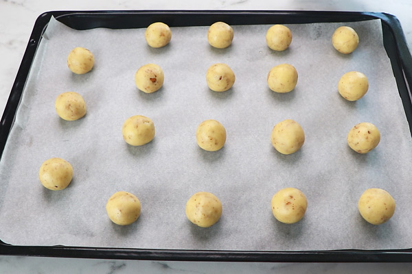 arrange the balls in a baking tray